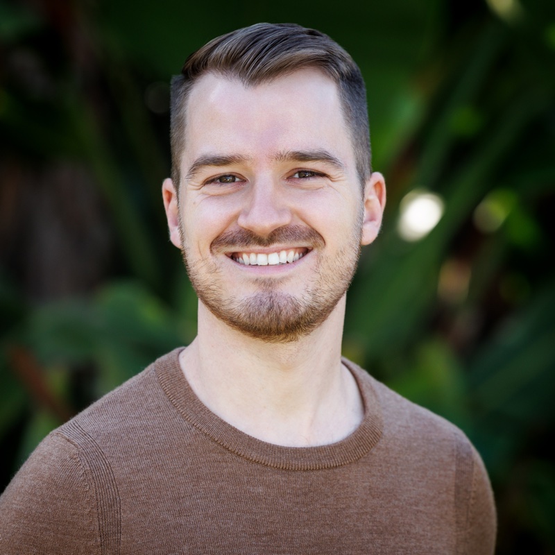 Kevin Rychel-Penn smiling outdoors.